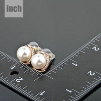 white pearl dome stud earrings detail view by KHAISTA