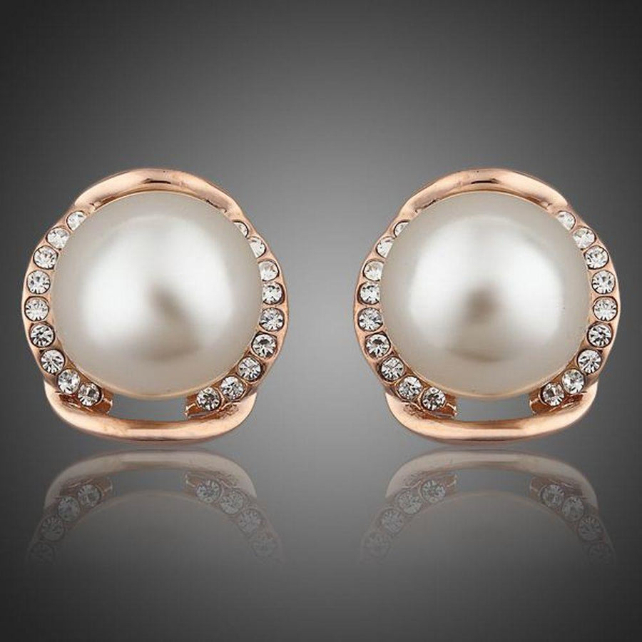 KHAISTA white pearl dome stud earrings on white background