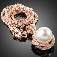 Close up detail of KHAISTA white pearl pendant necklace