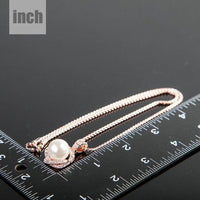 Pendant detail on KHAISTA white pearl pendant necklace