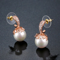 white pearl stud earrings detail view by KHAISTA