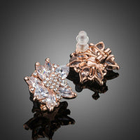 Close up of KHAISTA white rose CZ stud earrings