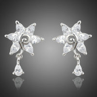 KHAISTA white rose CZ waterdrop earrings on white background