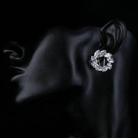 wreath design crystal stud earrings detail view by KHAISTA
